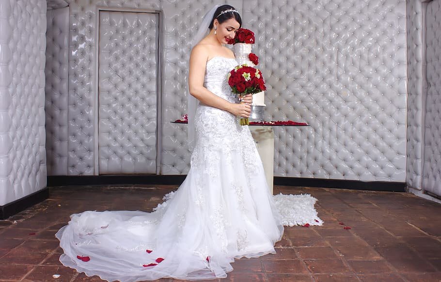woman holding flower bouquet indoors, sponge cake, wedding, kiss