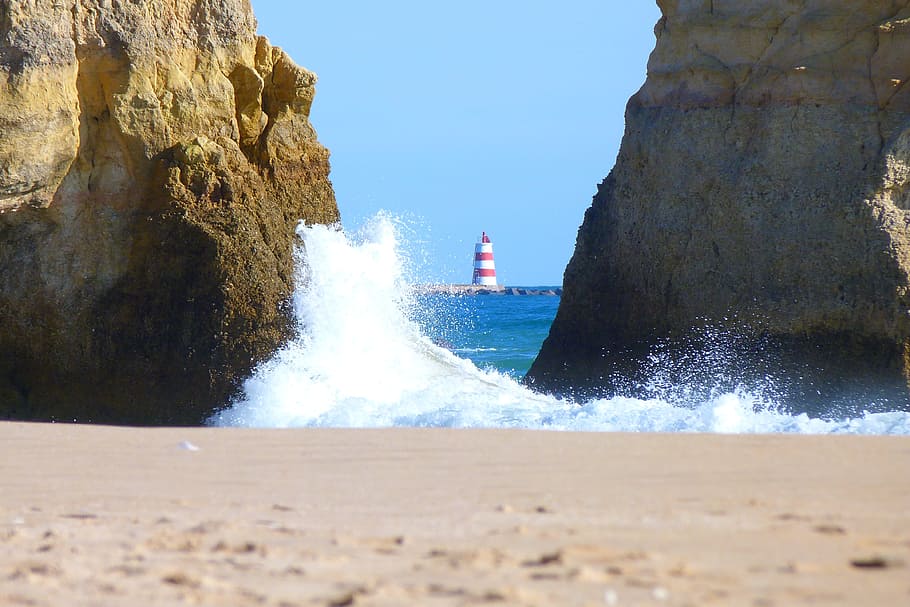water wave crushing on rock formation on seashore, Lighthouse HD wallpaper