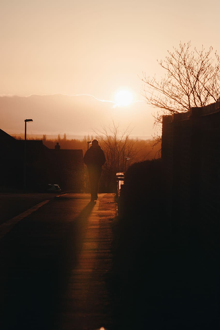 silhouette photo of man walking on street during golden hour, silhouette of walking person on road HD wallpaper