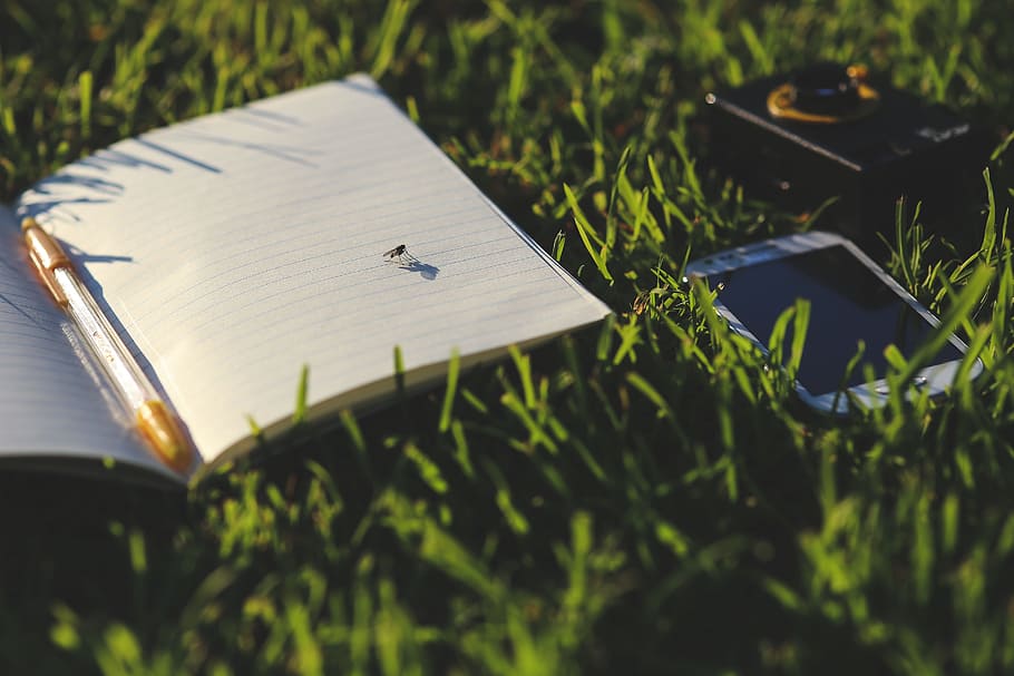 white smartphone beside white notebook on grass, fly, mobile HD wallpaper