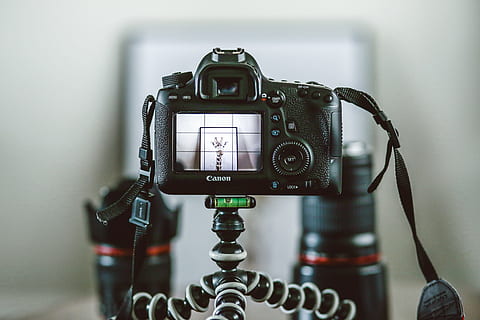 black Canon SLR camera attached on gorillapod, Canon DSLR camera on tripod HD wallpaper