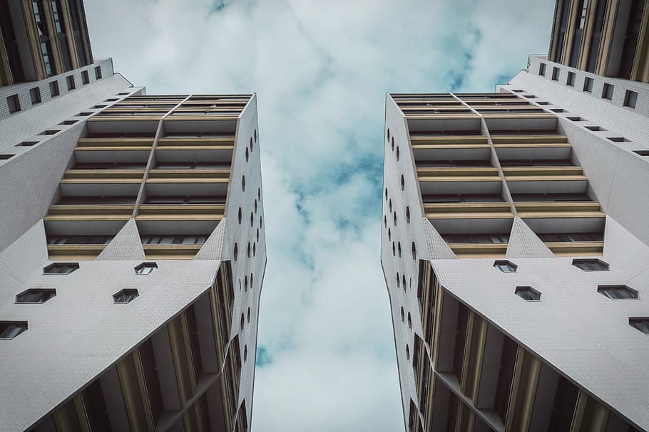 aerial view of buildings, white and brown concrete buildings under blue sky HD wallpaper