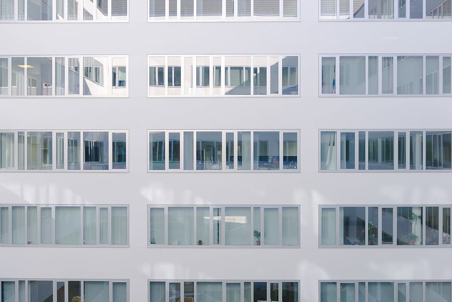 white building during daytime, photo of white concrete building with glass windows HD wallpaper