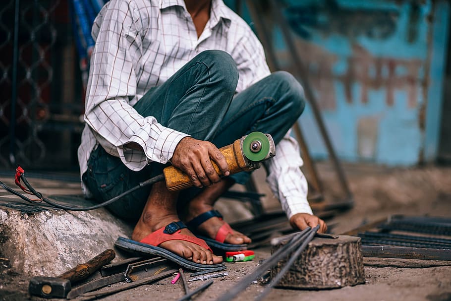 man holding angle grinder, active, architecture, asia, asian HD wallpaper