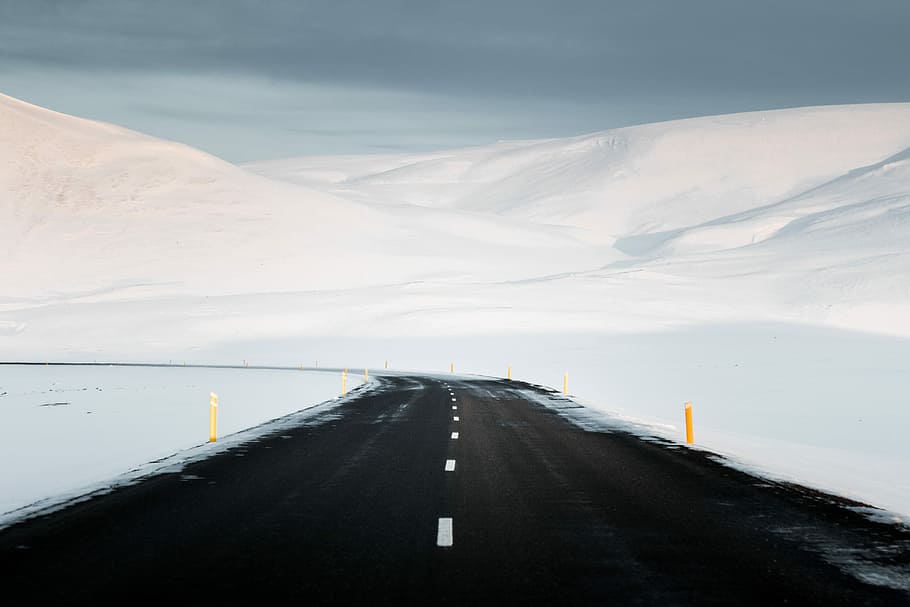 Alone on Route 1, road beside mountains, track, snow, white, cloud