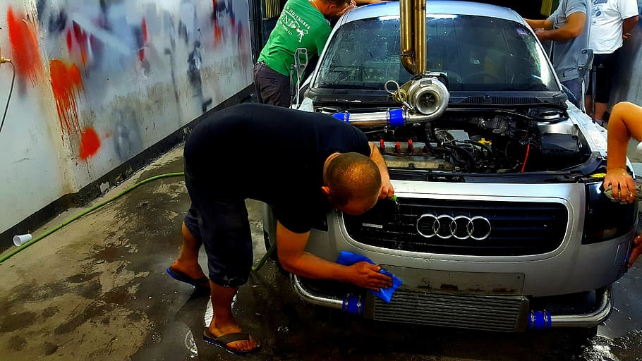 four men doing automotive work on silver Audi inside workshop, HD wallpaper