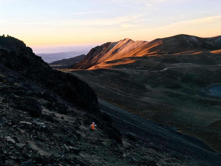 in distant brown mountain, person on mountain, desert, mountain range HD wallpaper