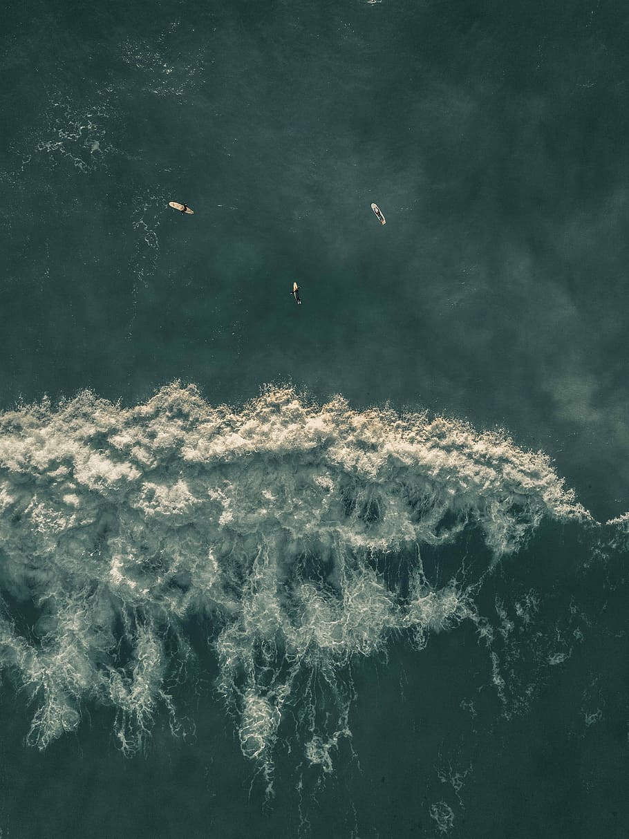 bird's eye-view photography of surfers on body of water, bird's-eye view photography of three surfers on body of water HD wallpaper