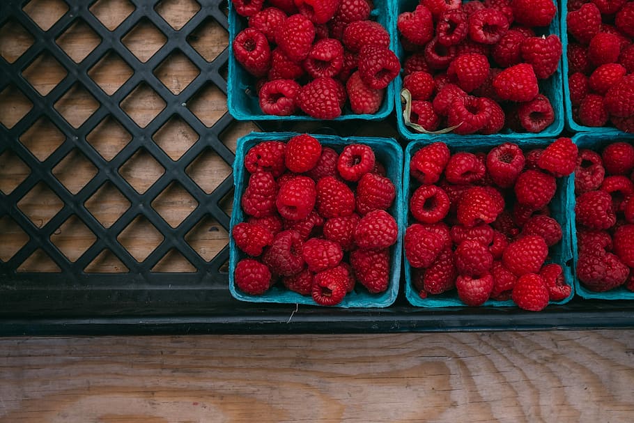 bunch of strawberries in containers, rashberries on blue basket HD wallpaper