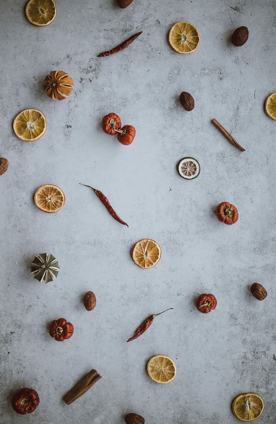 chilies, cinnamon and nutmeg, tomatoes and chili peppers on top of gray surface HD wallpaper
