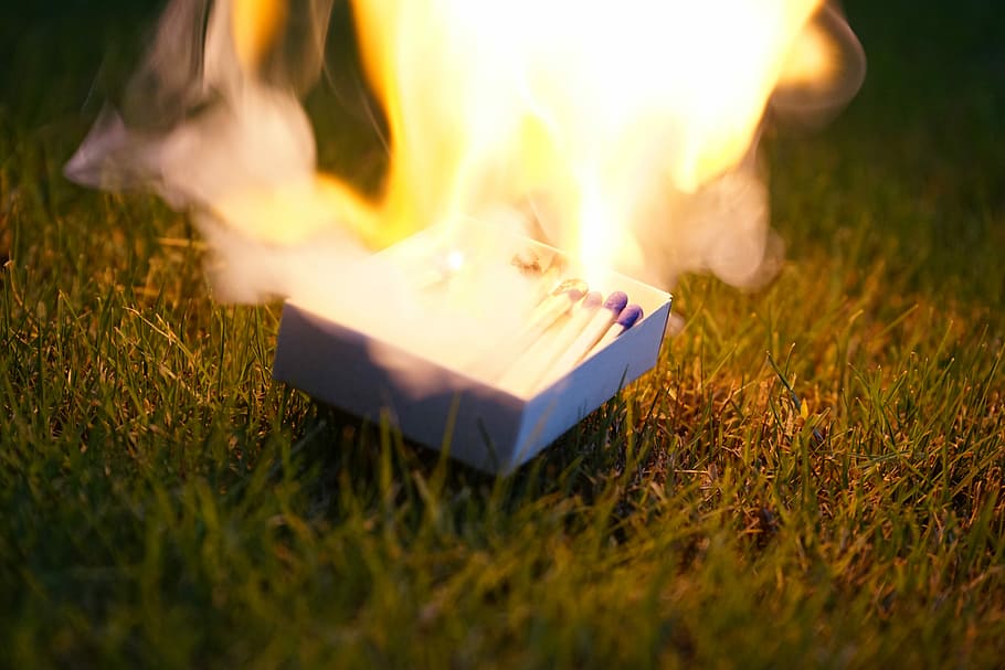 closeup photo of lighted matches on box placed on grass, matches stick on fire HD wallpaper
