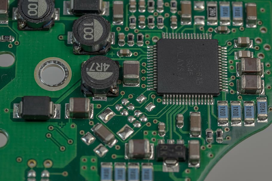 green circuit board showing computer processor, electronics, data processing