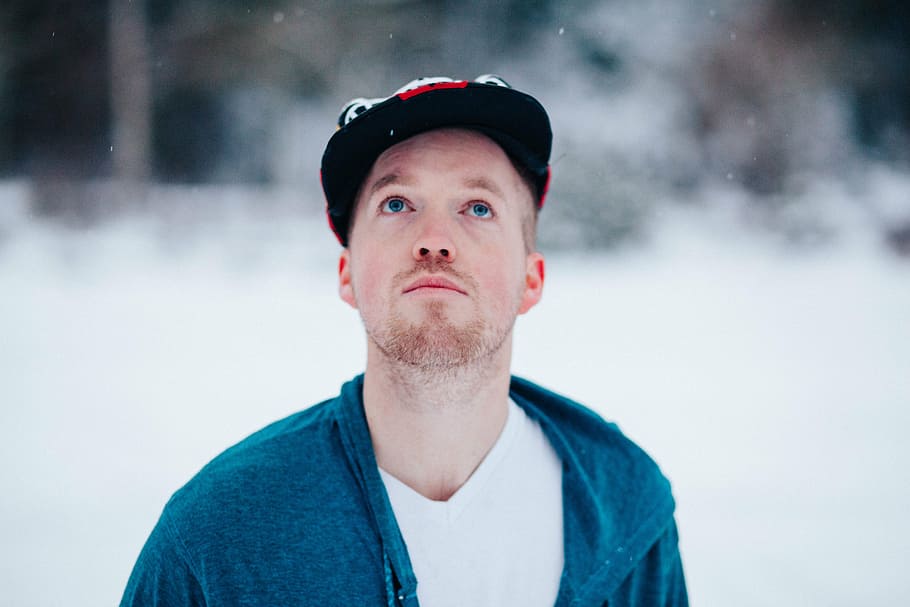 man standing on snow field, people, guy, winter, weather, cap HD wallpaper