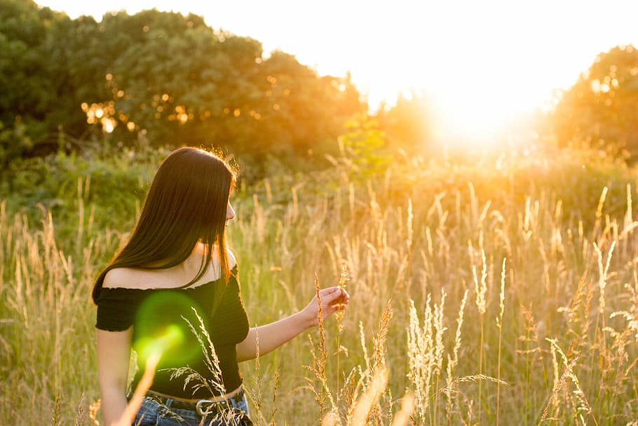 woman walking on grass, woman wearing black off-shoulder top standing on green grass HD wallpaper