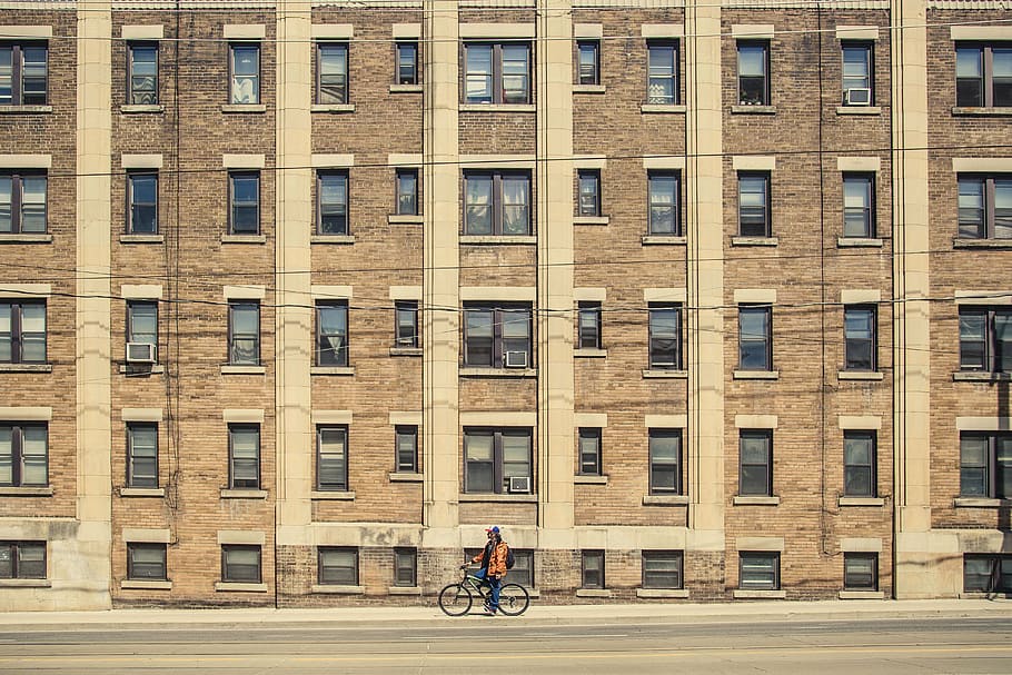person on bike near building, man, riding, bicycle, high, rise HD wallpaper