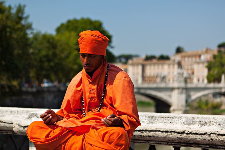Candid shot of a man in thought and meditation. Image captured on the River Tiber in Rome, Italy, HD wallpaper