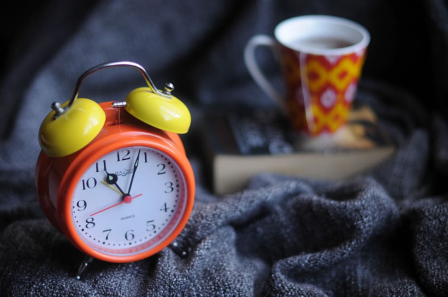 orange and yellow analog alarm clock at 11:03, red and yellow twin-bell alarm clock at 11:03 HD wallpaper