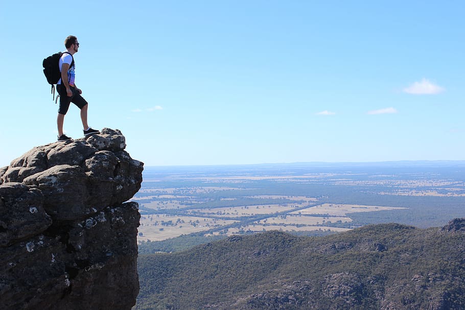 man with black backpack standing on mountain, scenic, hiking HD wallpaper