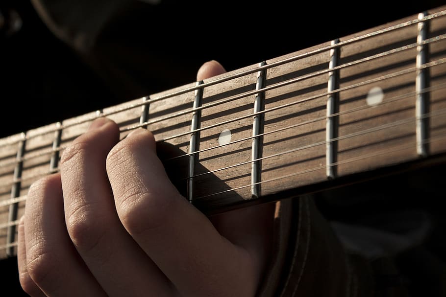 closeup photo of person playing guitar, music, rock, musical instrument