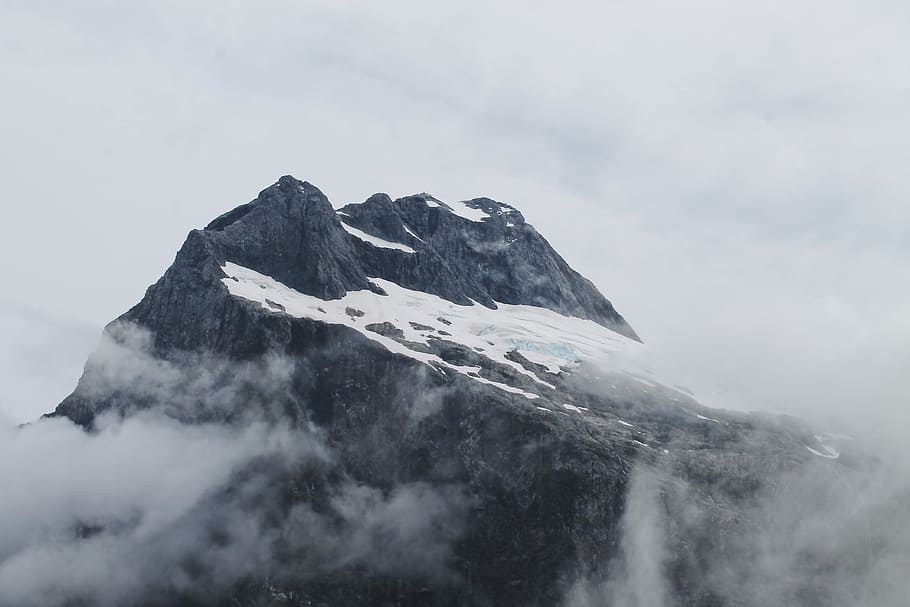 snow on top of mountain surrounded by clouds, Magnificent Milford Track HD wallpaper