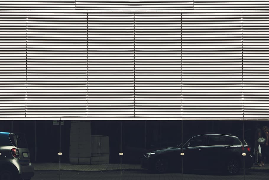 black 5-door hatchback parked on road, black SUV near half-opened garage gate HD wallpaper