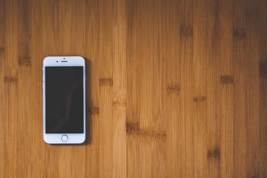 Silver Iphone 6 on Brown Wooden Surface, apple device, electronic HD wallpaper
