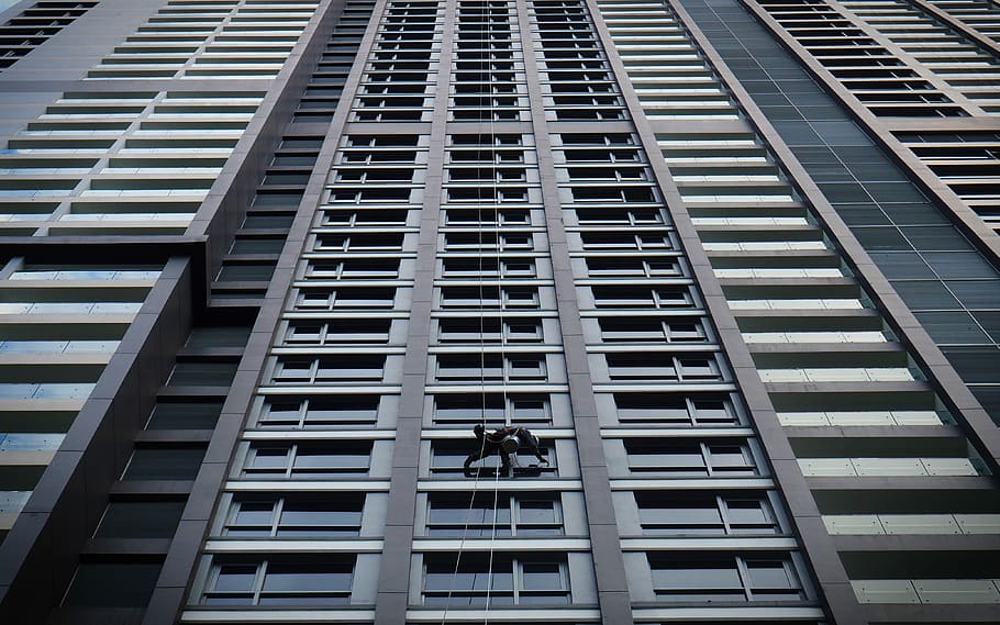 gray concrete building with glass windows, worm's eye view of building HD wallpaper