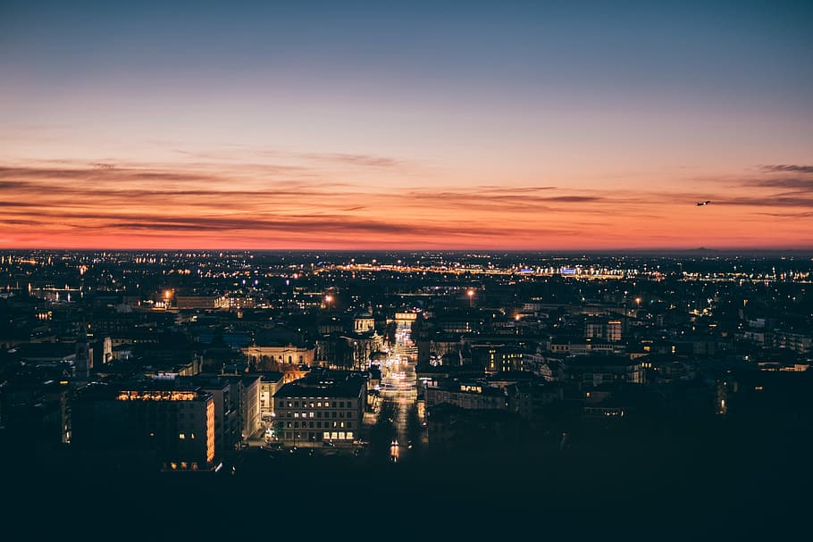 top view of city, aerial photography of building during golden hour HD wallpaper