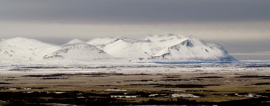 Winter in Borgarfjörður, landscape photography of mountain covering with snow HD wallpaper