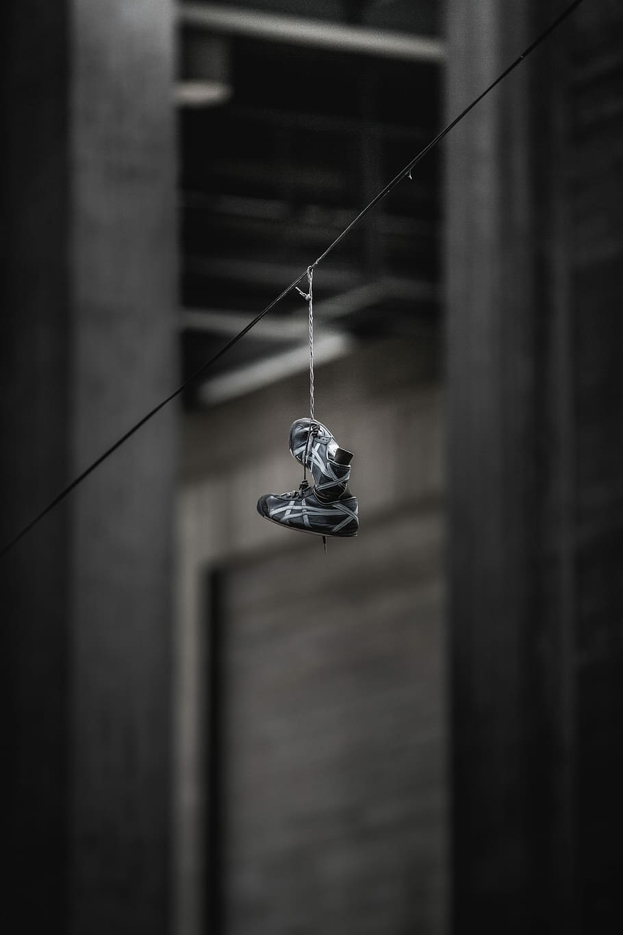 pair of black-and-gray ASICS shoes hanging on wire, pair of gray-and-white running shoes, HD wallpaper