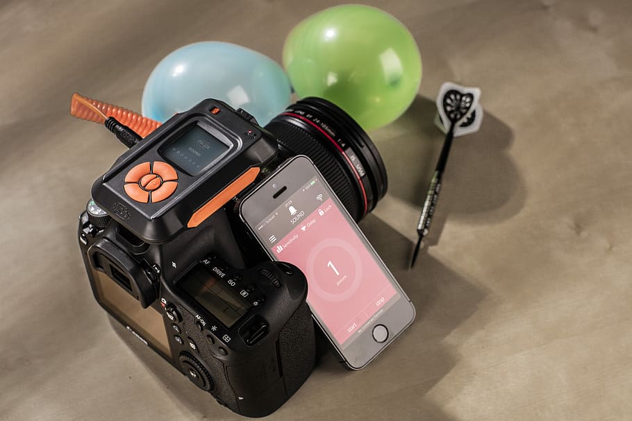 black DSLR camera on brown surface, DSLR camera and iPhone, screen HD wallpaper