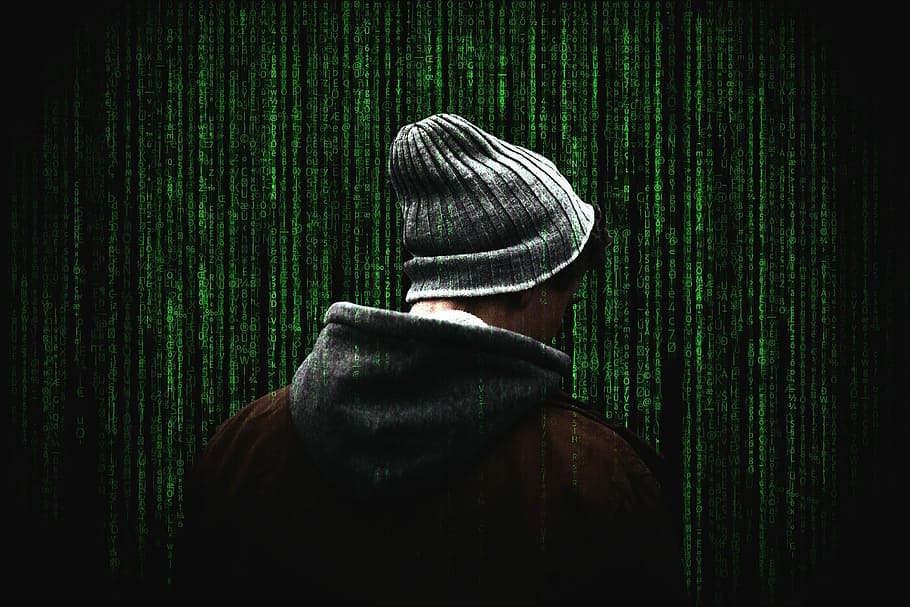 man standing near green wall, cyber security, cybersecurity, computer security