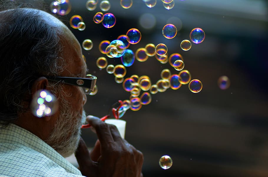 man blowing bubbles, colors, life, soap Sud, outdoors, bubble Wand HD wallpaper
