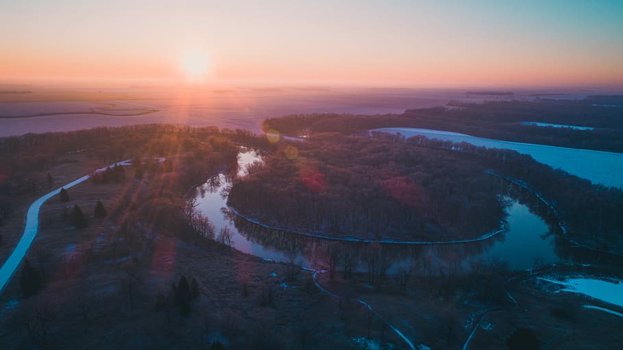 green leaf trees under blue sky during golden hour, bird's eye-view photography of body of water HD wallpaper