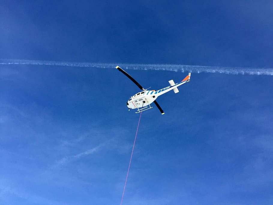 white helicopter on air at daytime, blue, sky, trails, rope HD wallpaper