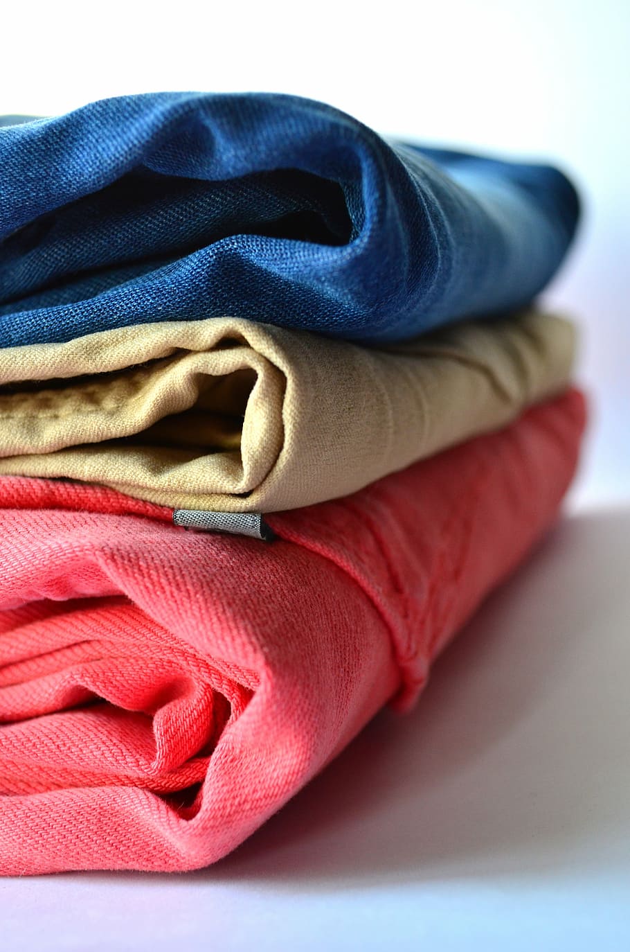 three denims on white surface, clothes, pants, clothing, stack HD wallpaper