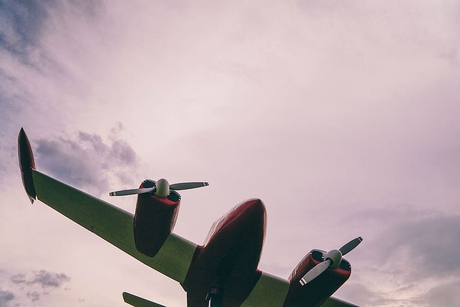 low-angle photograph of airplane, red and white airplane in the sky HD wallpaper