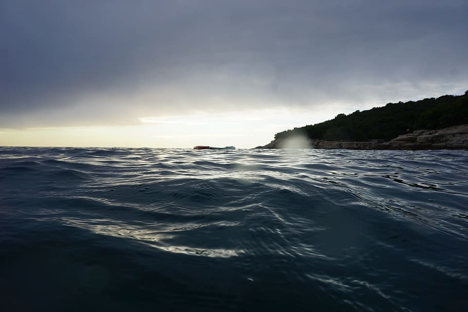 water, sunset, wave, clouds, view, wet, swim, evening, sky HD wallpaper