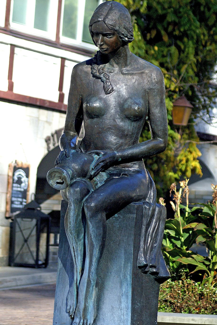 Bronze woman without bra, Fountain statue in Szczawnica, Po…
