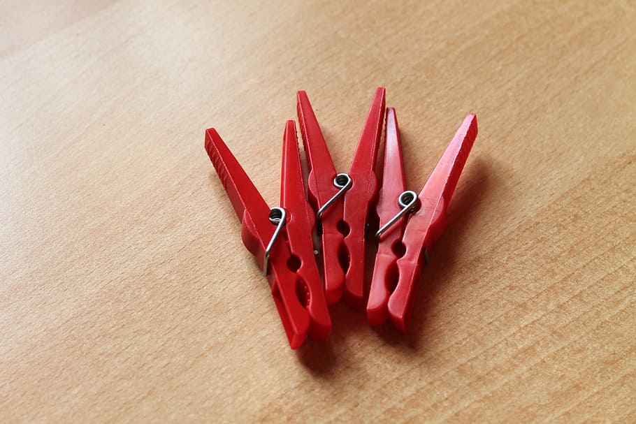 clothespins, red, clamp, plastic, indoors, table, wood - material HD wallpaper