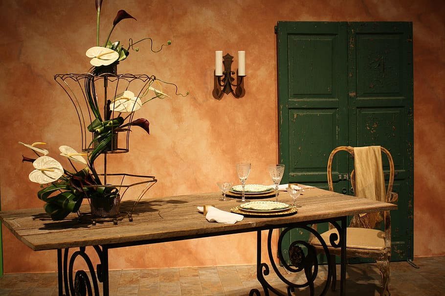rectangular brown wooden dining table near the green door, chair
