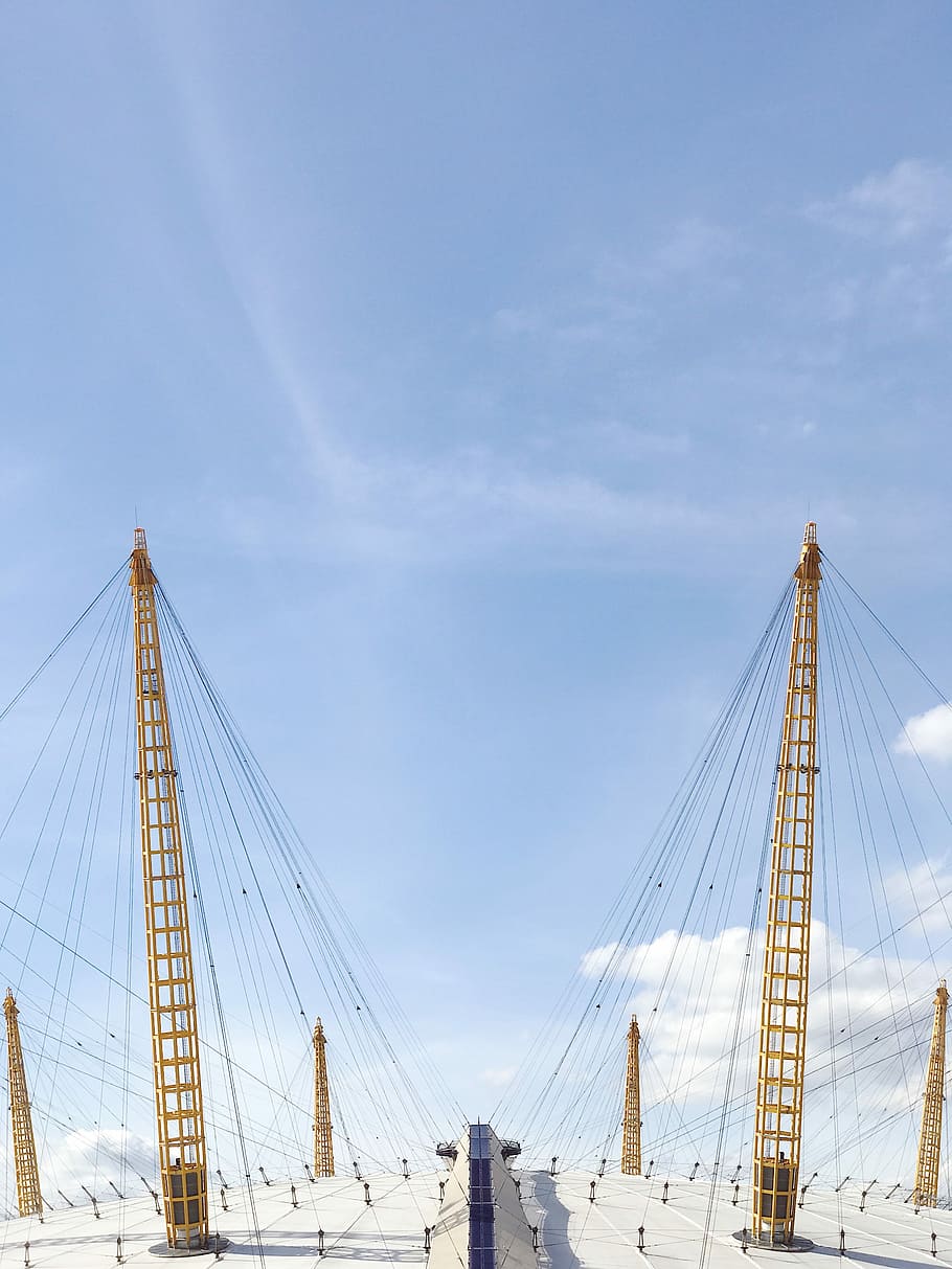 two yellow cable towers under blue sky, brown truss towers during daytime, HD wallpaper