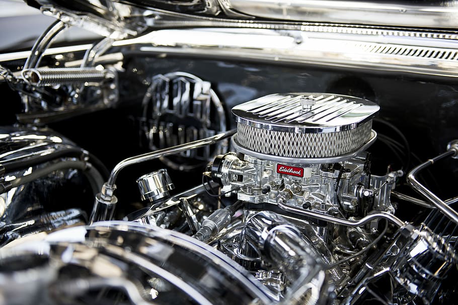 closeup photo of vehicle engine, closeup photography of chrome Edelbrock vehicle engine