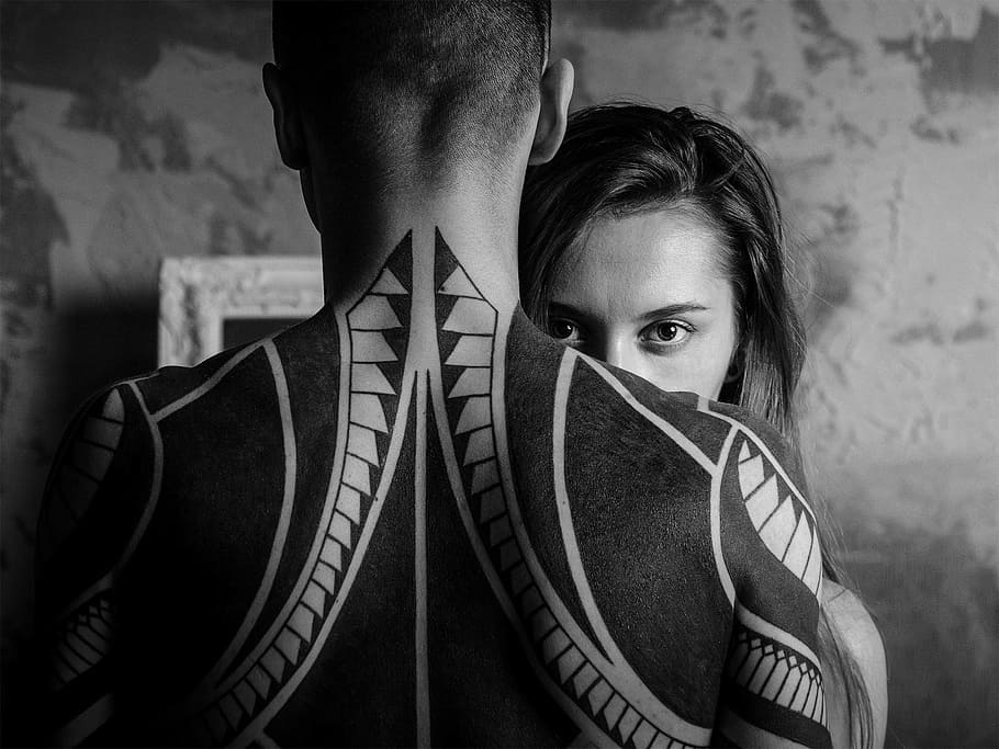 grayscale photography of woman hiding front of man with back tattoo, HD wallpaper