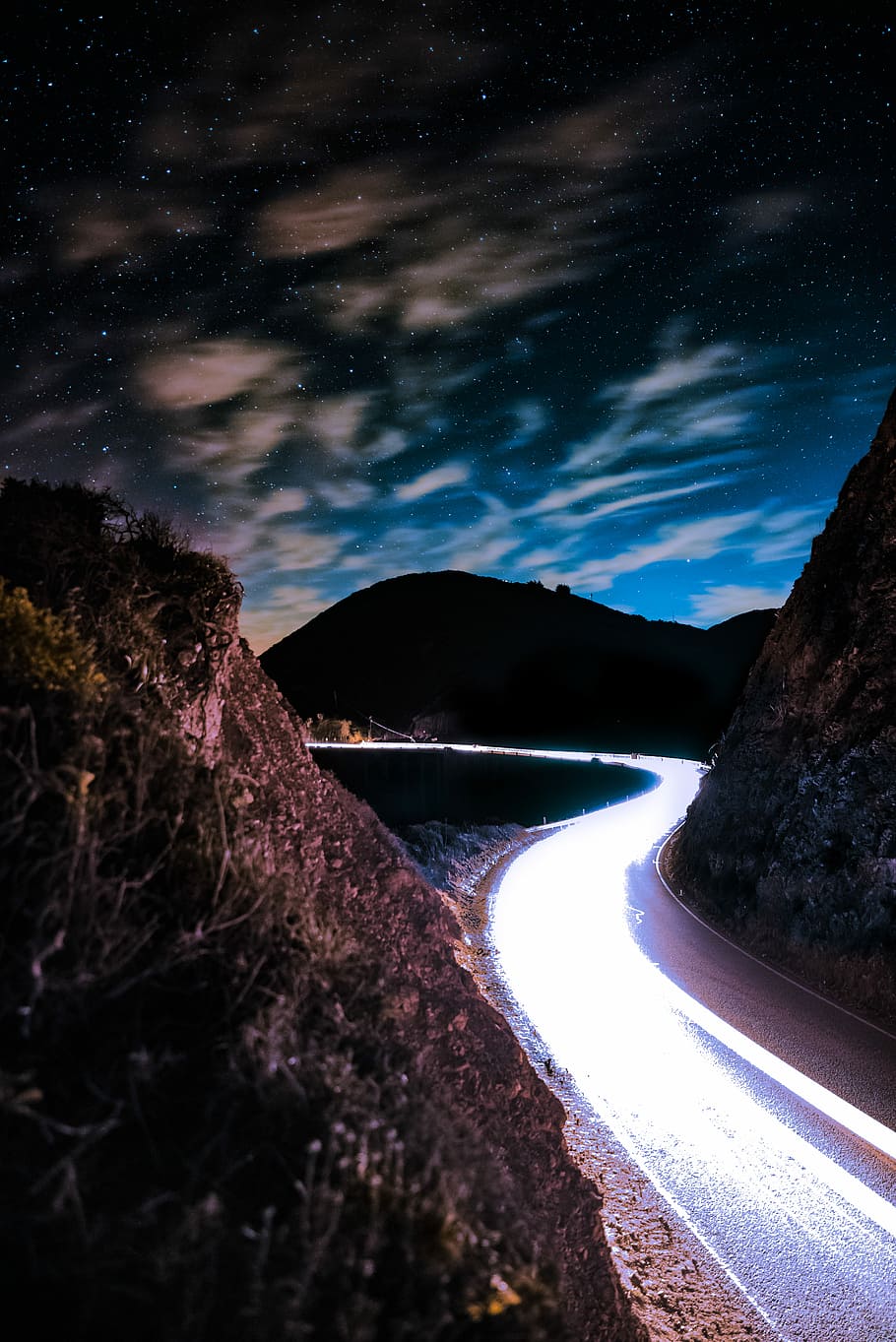 time lapse photography of road, brown mountains during night time HD wallpaper