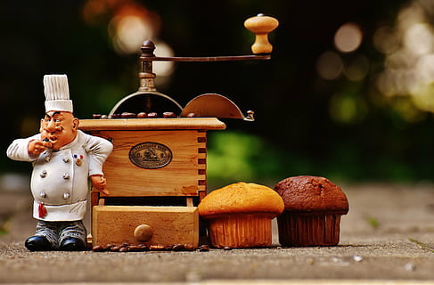 two brown and chocolate cupcakes near music box, grinder, muffin HD wallpaper
