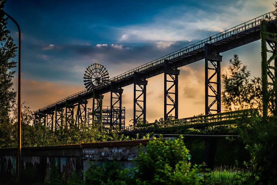 in distant photo of gray bridge, construction, sunset, orange HD wallpaper