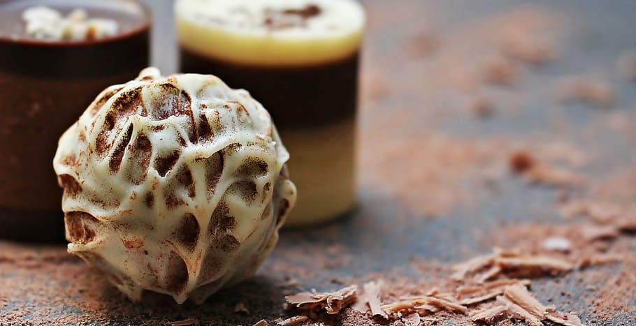 close up photography of chocolate coated pastry, chocolates HD wallpaper