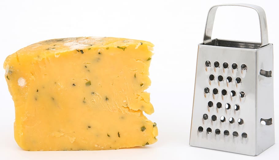 cheese beside silver cheese shredder, age, bacteria, biology