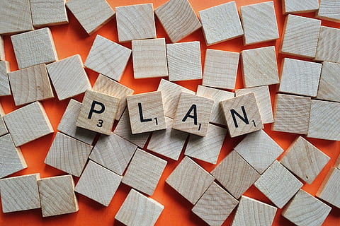brown wood letter blocks showing plan text, objective, strategy HD wallpaper